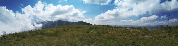 istock Panoramic view of a mountain passage and sky with clouds 1204304249