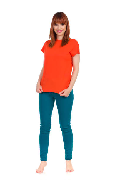 istock Standing Barefooted Young Woman In Vibrant Clothes 1204305128