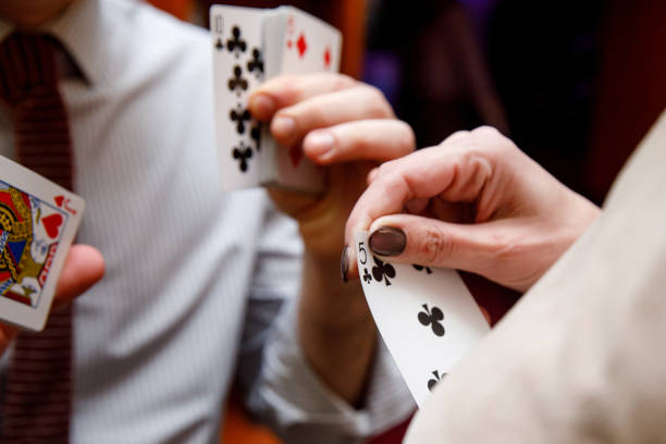 istock Unsuccessful combination of playing cards in the hands 1204305713