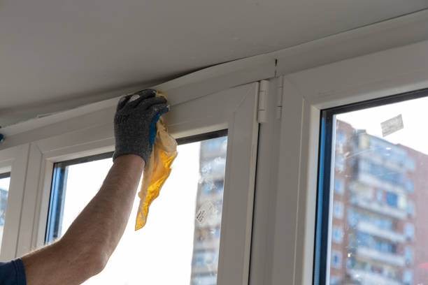 istock Handyman installing glass windows on terrace and carpentry work 1204312205