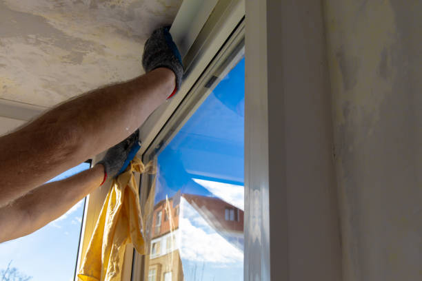 istock Handyman installing glass windows on terrace and carpentry work 1204312240