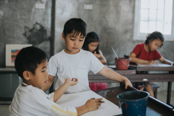 istock Thai children at drawing and painting class 1204316278