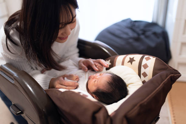 istock Mother talking to newborn 1204316641