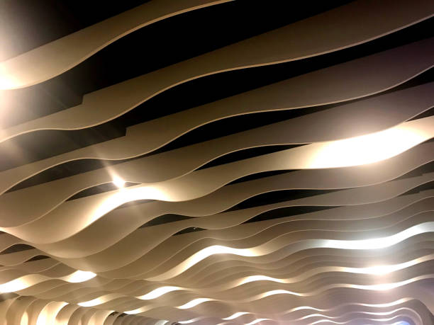 istock Curve ceiling line with spot light in modern building 1204318266
