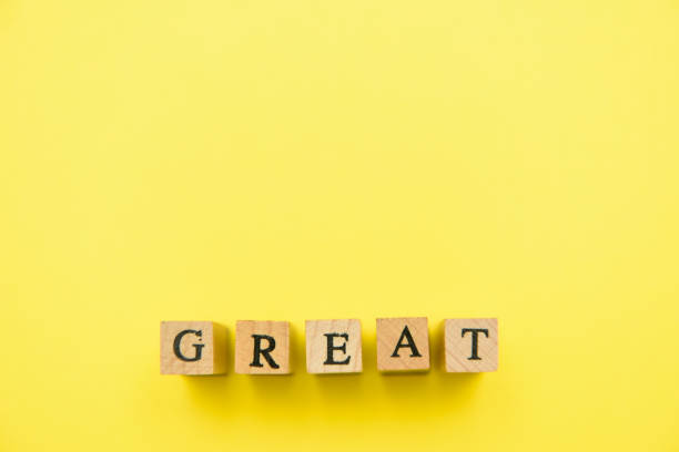 istock alphabet numeral stamp yellow 1204319052
