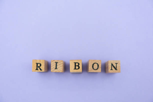 istock alphabet numeral stamp purple 1204320030