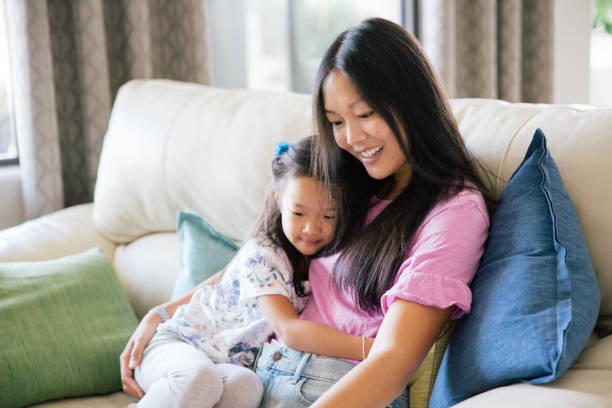 istock Mother and daughter share a laugh together 1204329121