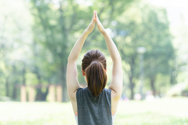 istock yoga poses at the park 1204329913