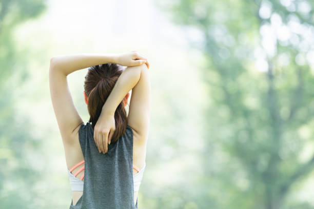 istock yoga poses at the park 1204329920