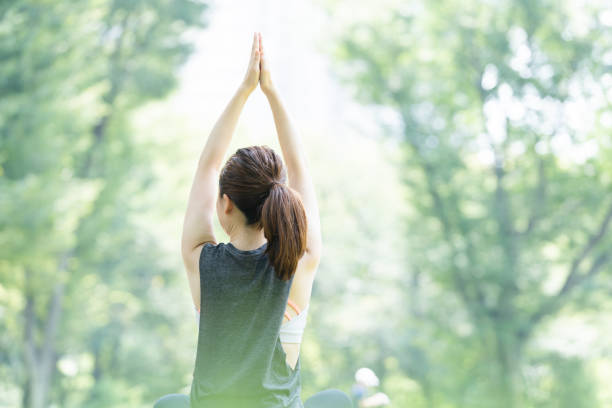 istock yoga poses at the park 1204329939