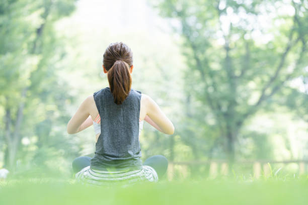 istock yoga poses at the park 1204329942