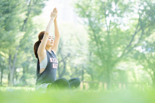 istock yoga poses at the park 1204329944