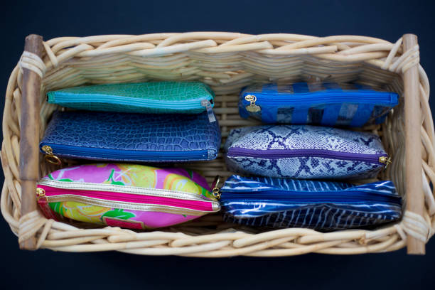 istock Cosmetic Bags Neatly Organized in Wicker Basket 1204329961