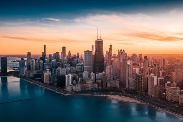 Dramatic Sunset - Downtown Chicago Aerial Dramatic View of Downtown Chicago at Sunset - Lake Shore Drive office building exterior photos stock pictures, royalty-free photos & images