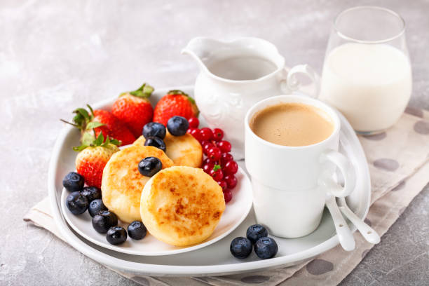 istock Cottage cheese pancakes with berries. Selective focus. Russian cheesecakes. Copy space 1204333291