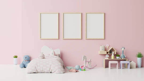 istock Mock up posters in child room interior on pink background. 1204333399