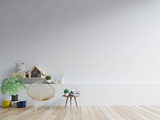 istock The interior has a chair on empty white wall background. 1204333409