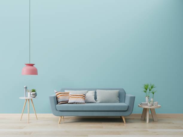 istock Modern living room interior with sofa and green plants,lamp,table on blue wall background. 1204333428