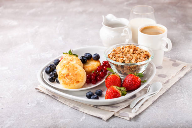 istock Cottage cheese pancakes with berries. Selective focus. Russian cheesecakes. Copy space 1204333509