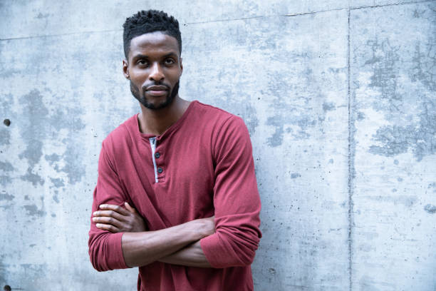 istock Black Male Against a Concrete Wall 1204334565