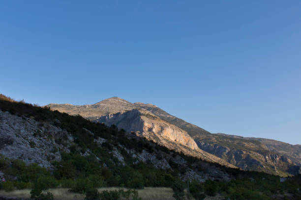 istock Mountains against the blue sky . Mountains in Montenegro. Selective focus. 1204335522