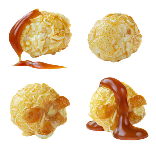 istock Popcorn pieces  with Caramel sauce isolated on white background. Collection. Salty Pop corn macro. 1204335640