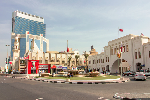 Street scene in the Customs Square in central business district of Manama, Bahrain, with the historical Bab Al Bahrain, the ancient gateway to the city of The Persian Gulf