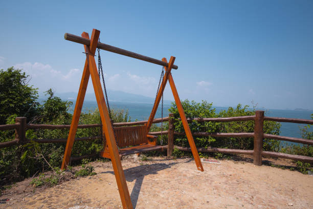 istock swing beside the sea in china 1204338333