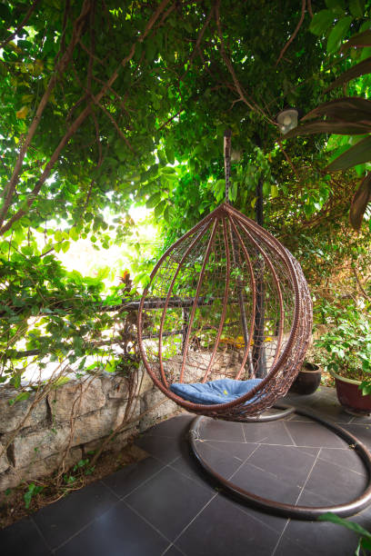 istock wooden chiar in the garden 1204338530
