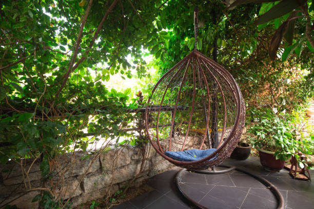 istock wooden chiar in the garden 1204338547