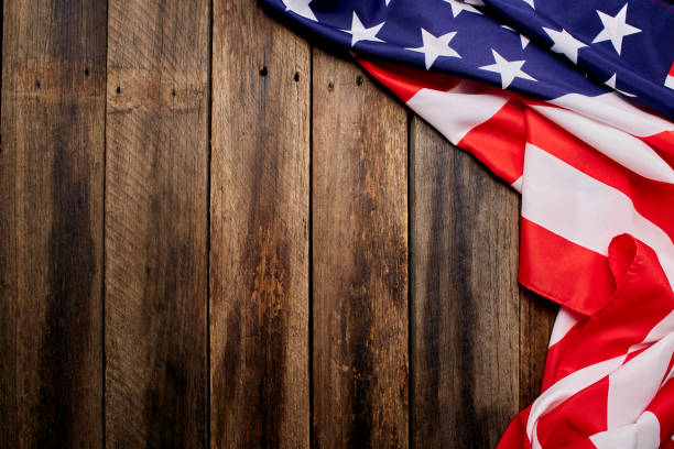 istock USA flag on an empty old wooden background 1204341490