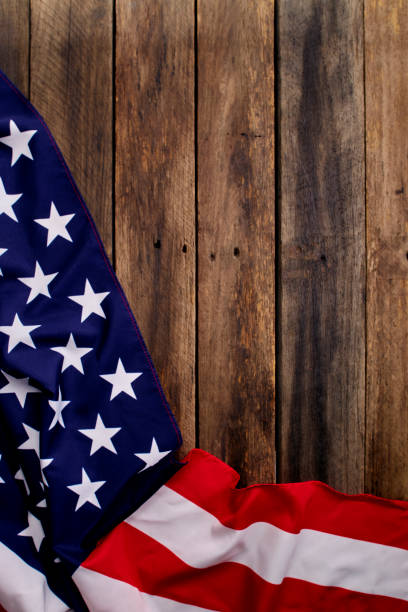 istock USA flag on an empty old wooden background 1204341496