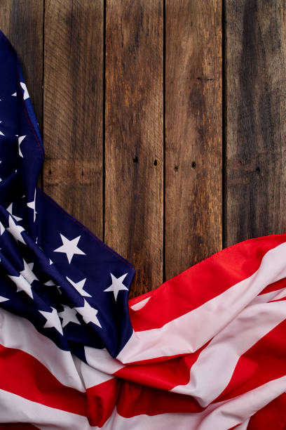 istock USA flag on an empty old wooden background 1204341504