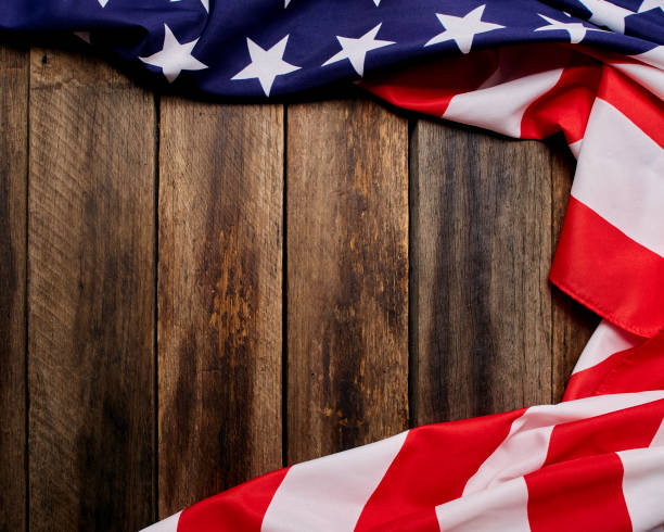 istock USA flag on an empty old wooden background 1204341516
