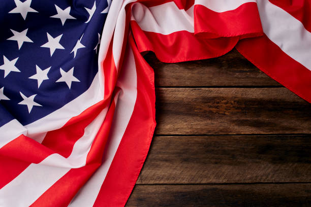 istock USA flag on an empty old wooden background 1204341524