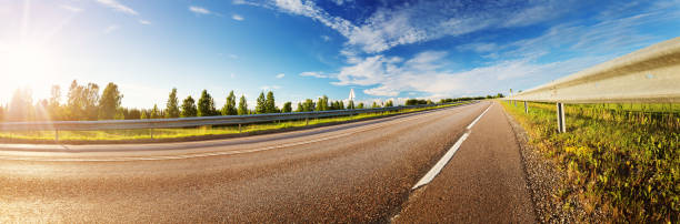 istock asphalt road panorama in countryside on sunny summer day 1204345882