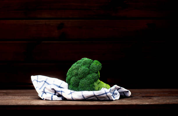 istock Fresh green broccoli  in bowl on wooden table close up. Copyspace 1204347121