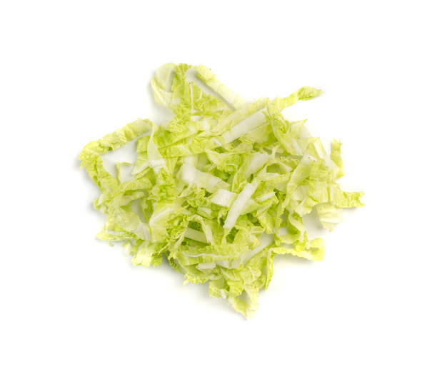 Heap of Chopped Chinese Cabbage, Napa Cabbage or Wombok Heap of Chopped Chinese Cabbage, Napa Cabbage or Wombok Isolated on White Background. Fresh Green Sliced Cabbage Salat Top View shredded stock pictures, royalty-free photos & images
