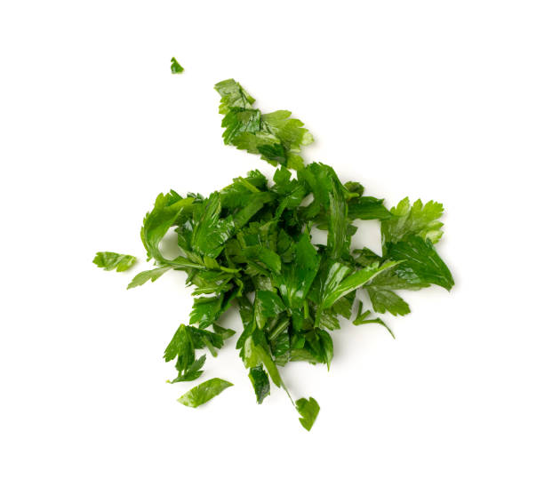 istock Fresh Green Chopped Parsley Leaves Isolated on White Background 1204350610