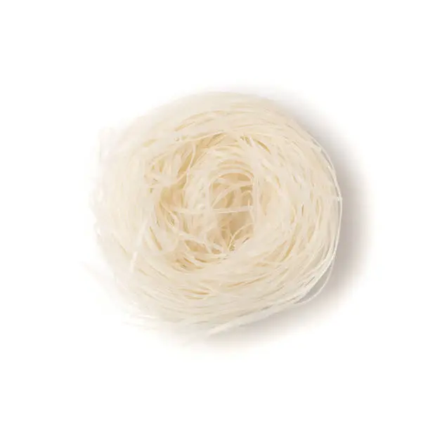 Raw dry rice noodles on wooden plate top view. Traditional asian rice vermicelli isolated on white background