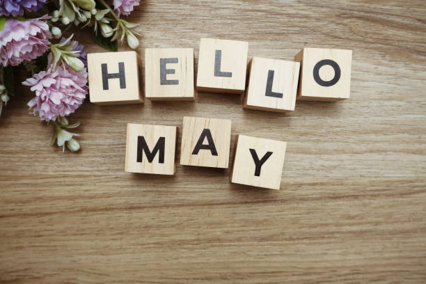 istock Hello May alphabet letters on wooden background 1204350830
