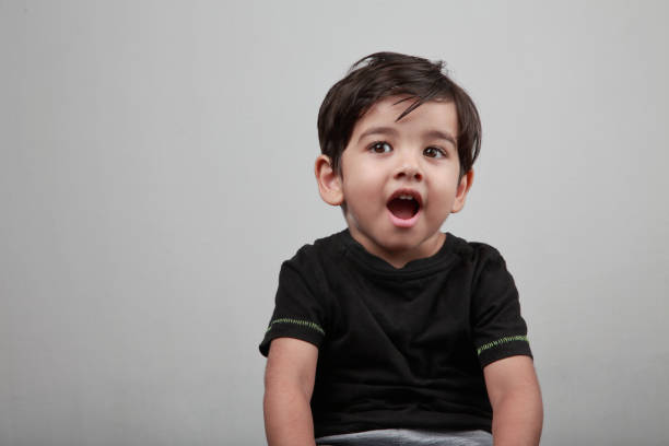 istock Cute little boy with a surprised face 1204352572