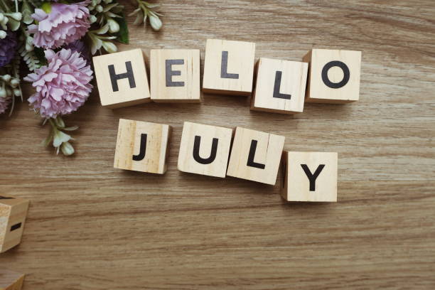 istock Hello July alphabet letters on wooden background 1204352596