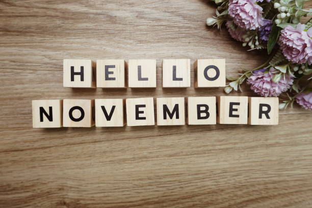 istock Hello November alphabet letters on wooden background 1204353685