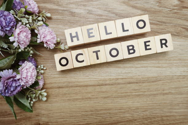 istock Hello October alphabet letters on wooden background 1204353712
