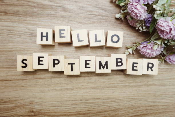 istock Hello September alphabet letters on wooden background 1204353732