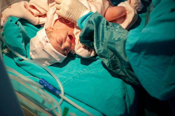 istock Newborn baby crying minutes after birth 1204353901