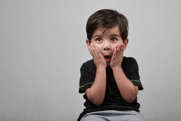 istock Cute little boy with a surprised face 1204353976
