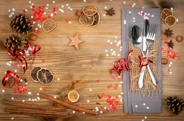 istock Christmas Dinner Table Setting with Cutlery and Winter Spices 1204354858