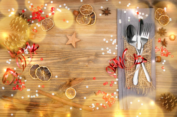 istock Christmas Dinner Table Setting with Cutlery and Winter Spices 1204354862